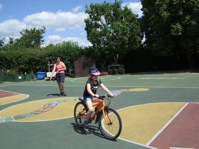 Children learning to ride